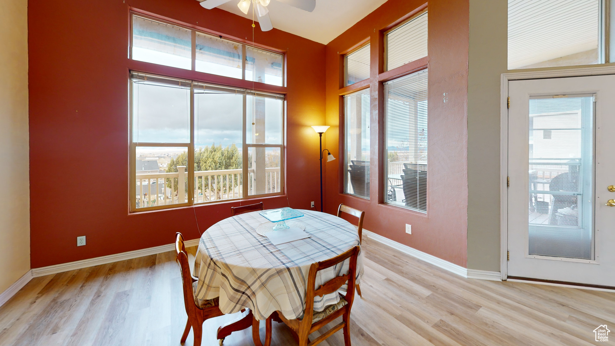 Dining room featuring plenty of natural light, ceiling fan, and light wood-type flooring