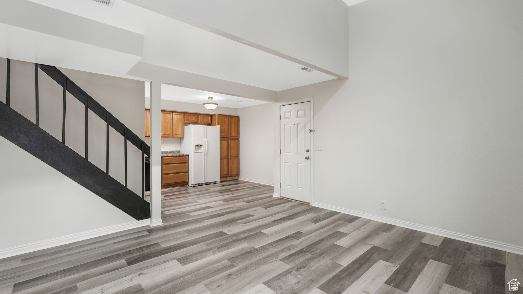 Entrance foyer featuring light wood-type flooring