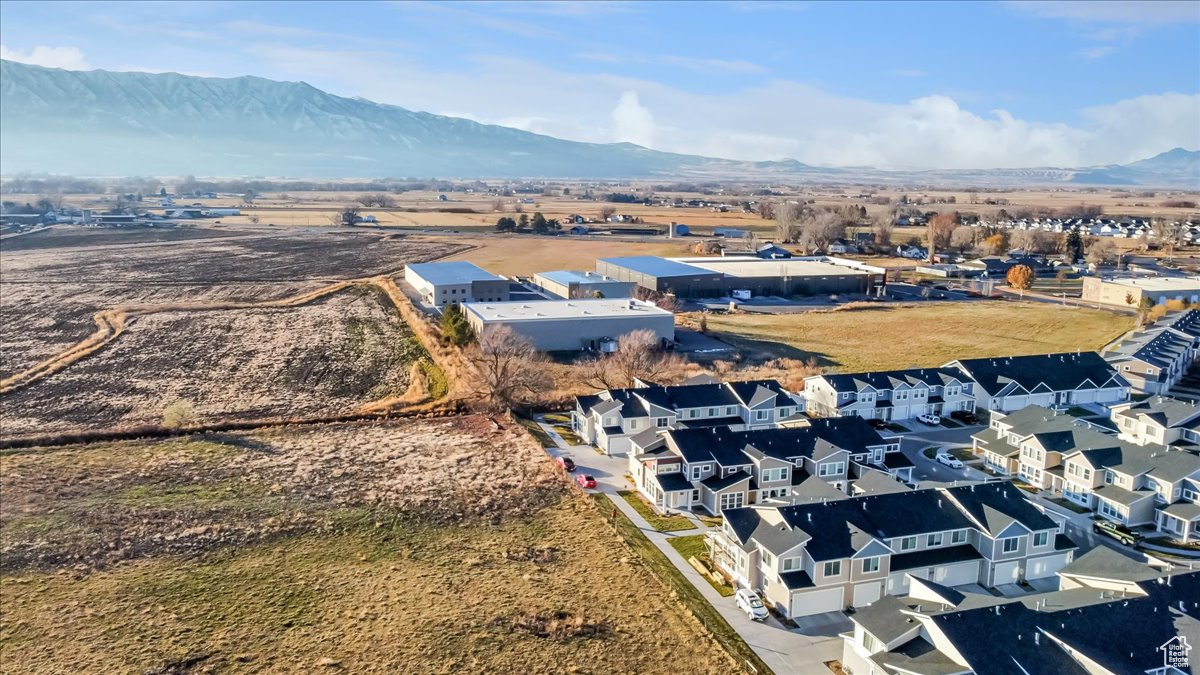 Birds eye view of property with a mountain view