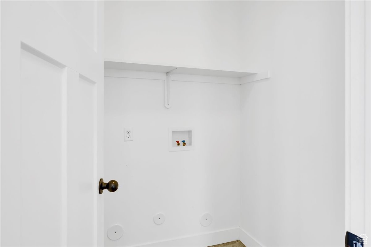 Laundry room featuring hookup for a washing machine and hookup for a gas dryer