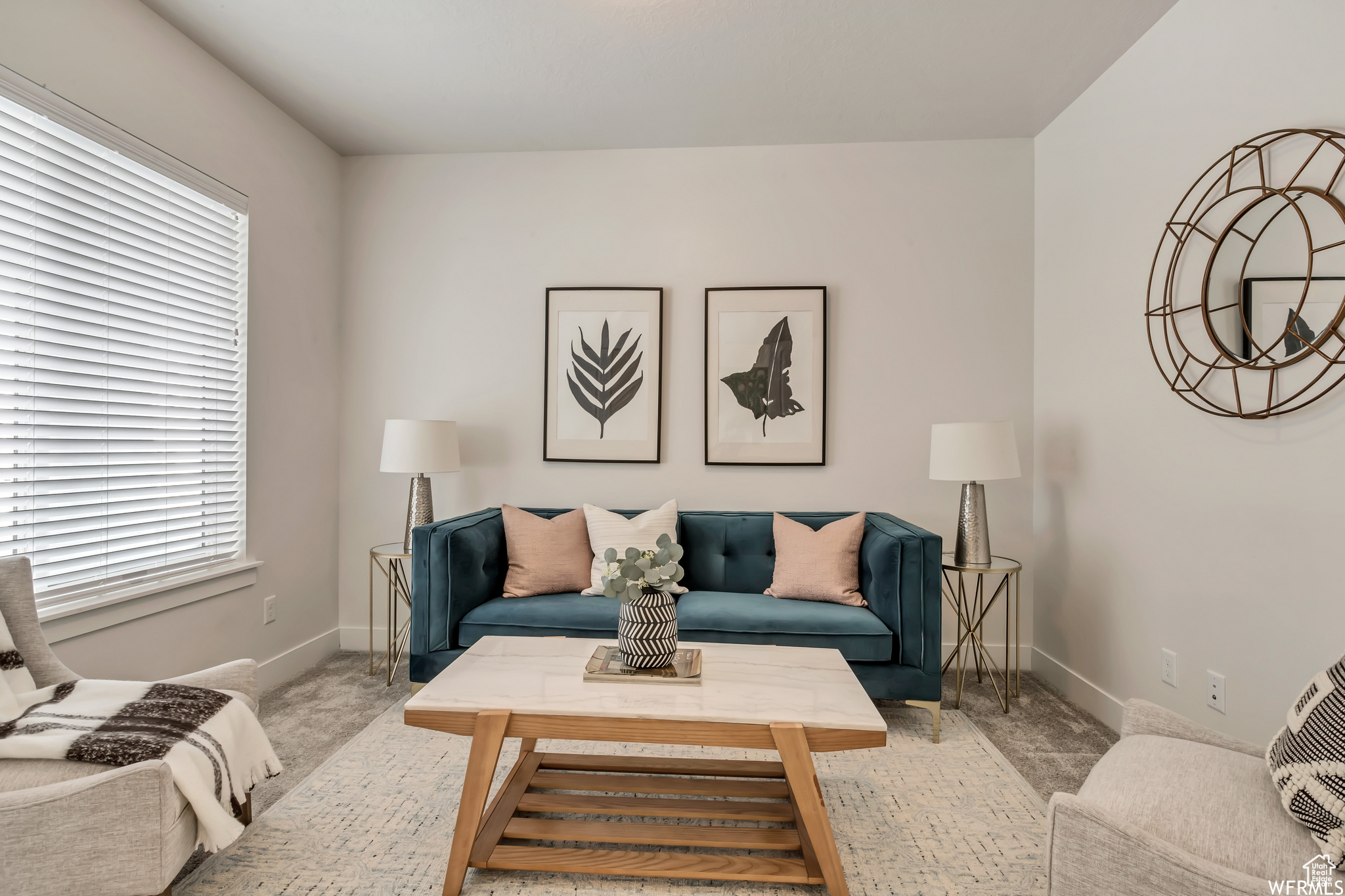 Carpeted living room featuring plenty of natural light