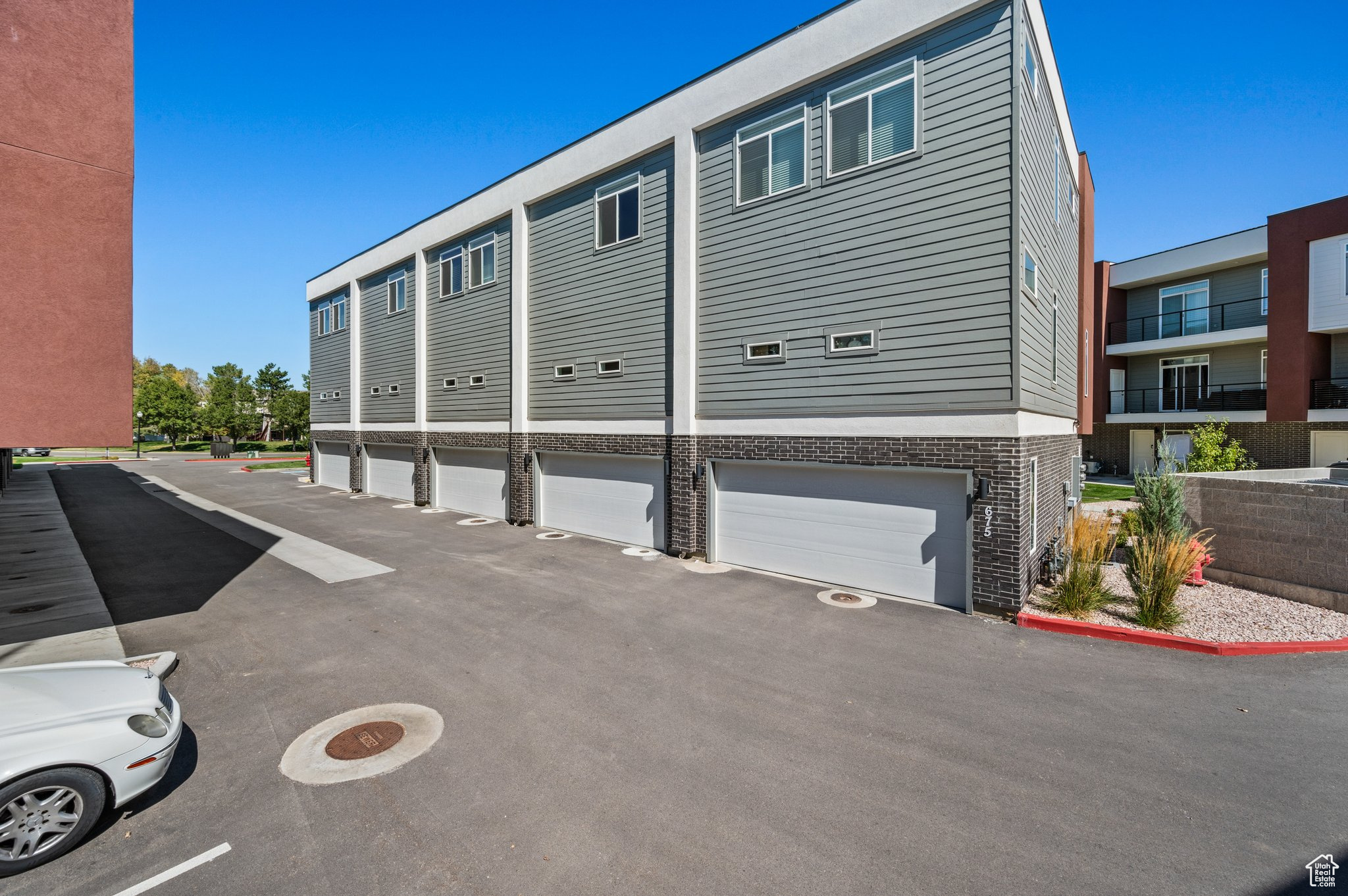 View of side of home featuring a garage