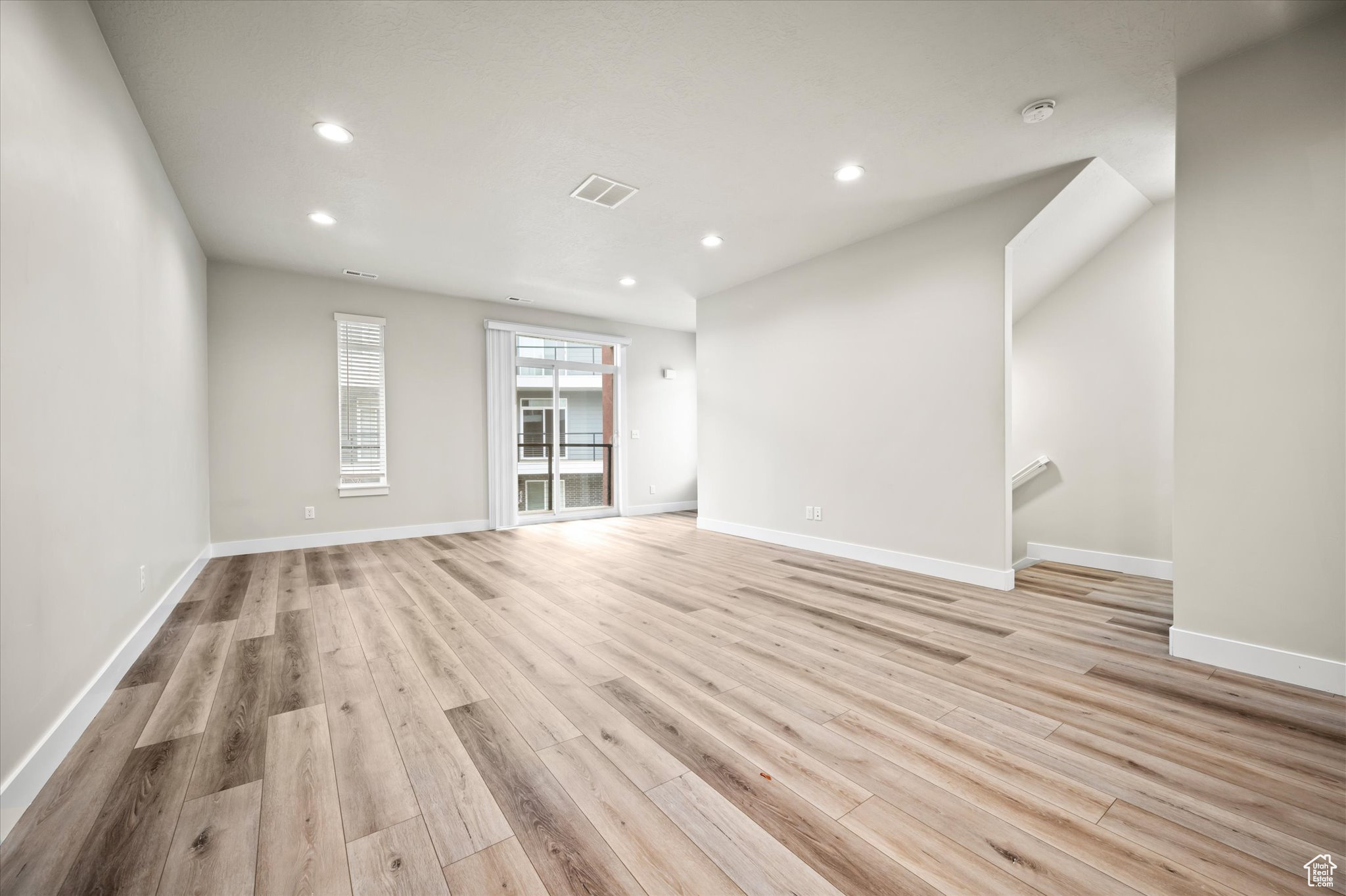 Empty room featuring light wood-type flooring