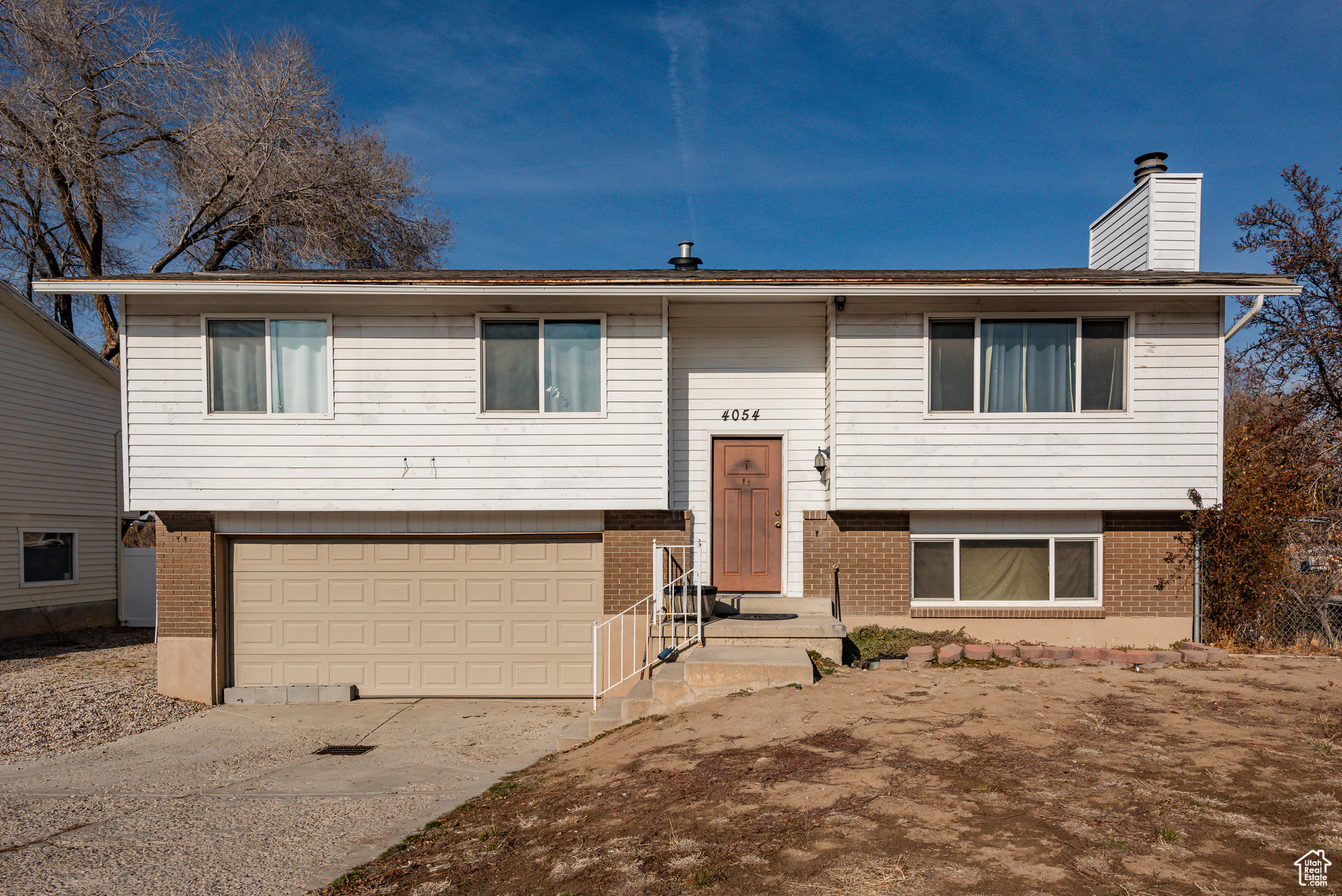 Raised ranch featuring a garage