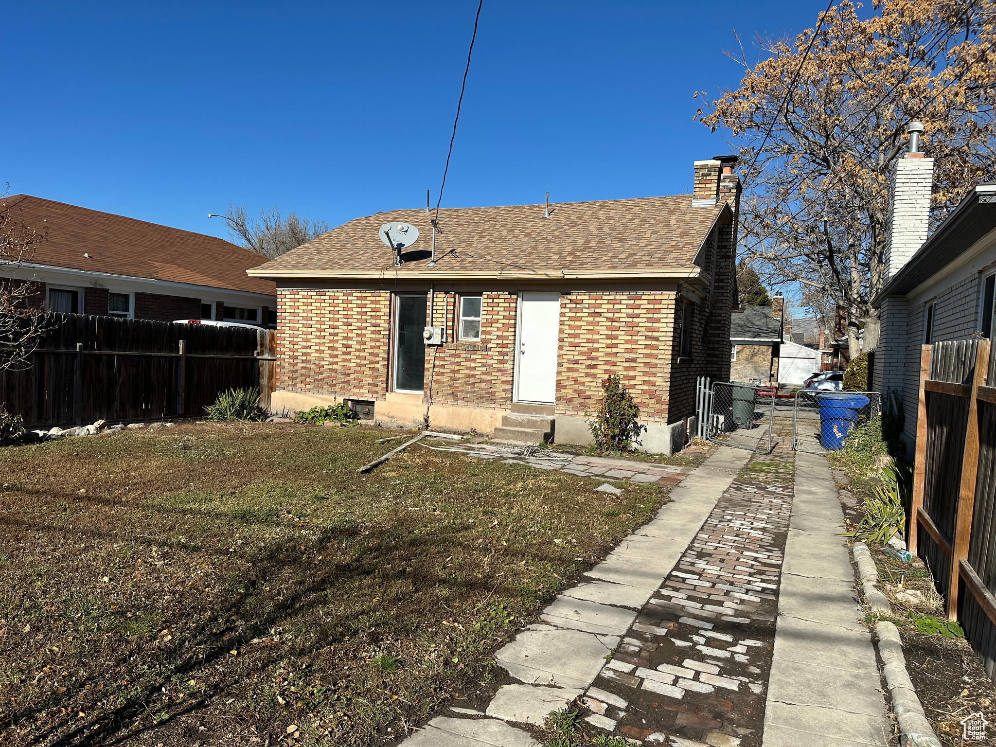 Rear view of house with a lawn