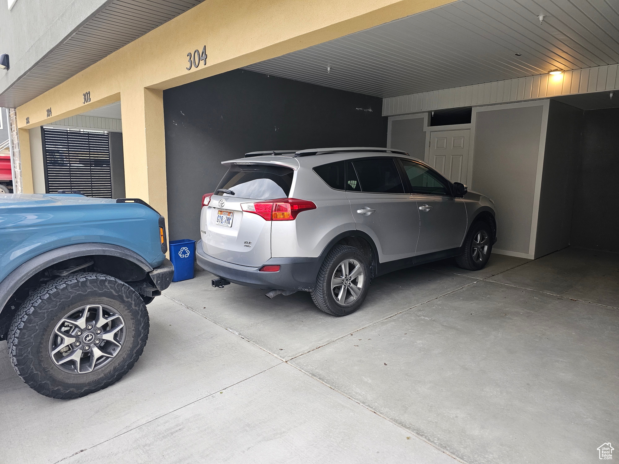 Garage, enclosed, just no garage door.