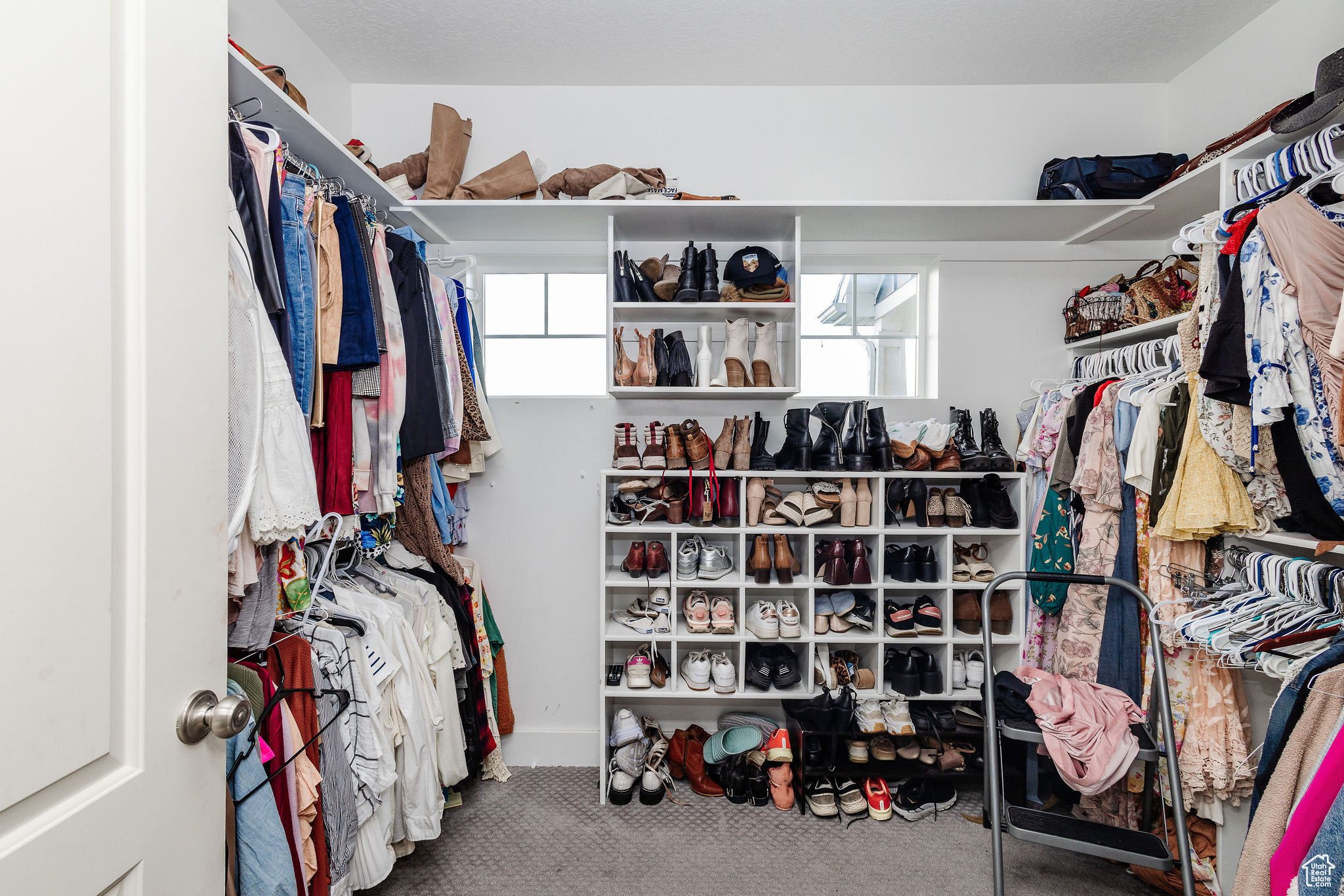 Spacious closet featuring carpet flooring