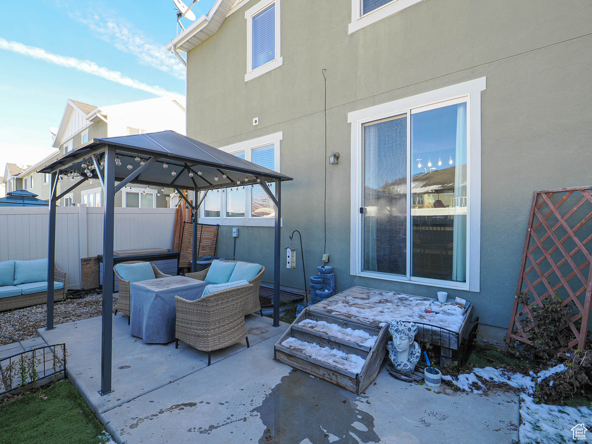 View of patio with a gazebo and an outdoor living space