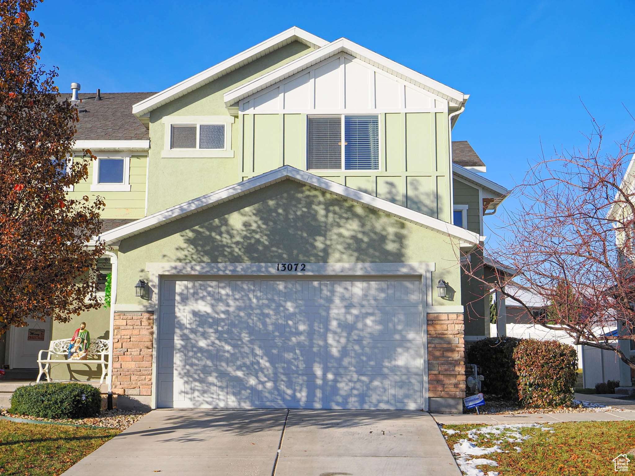 View of front facade featuring a garage