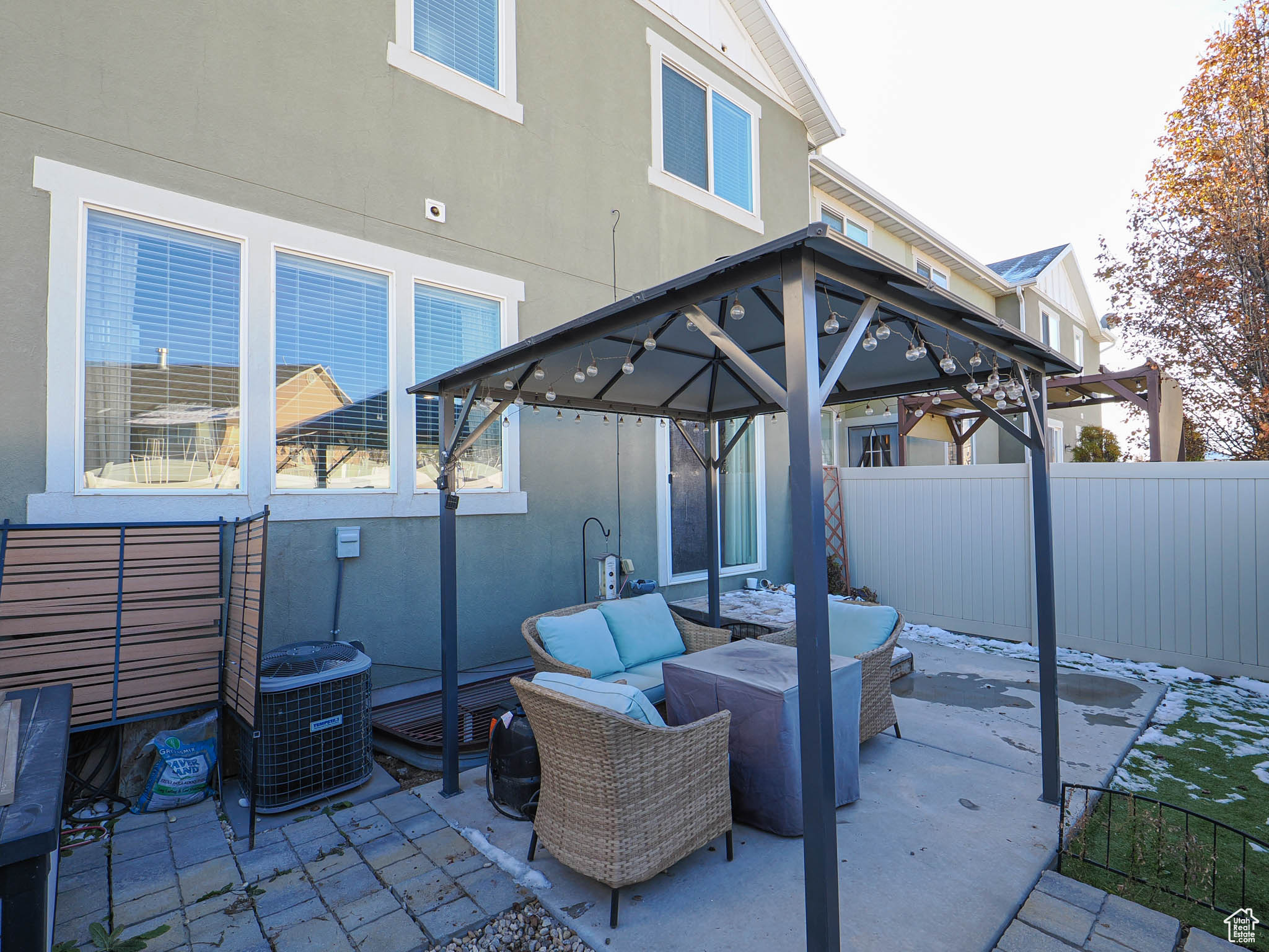 View of patio / terrace with central AC unit, an outdoor living space, and a gazebo