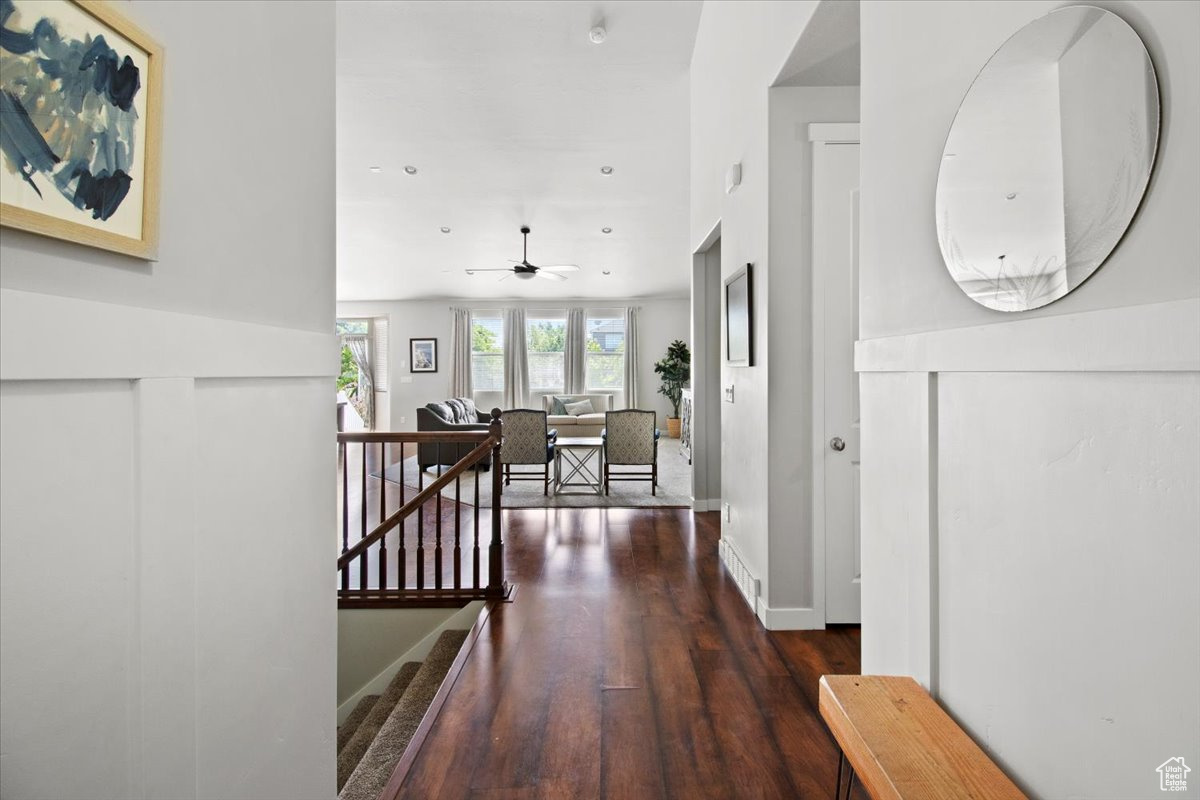 Hall with dark wood-type flooring