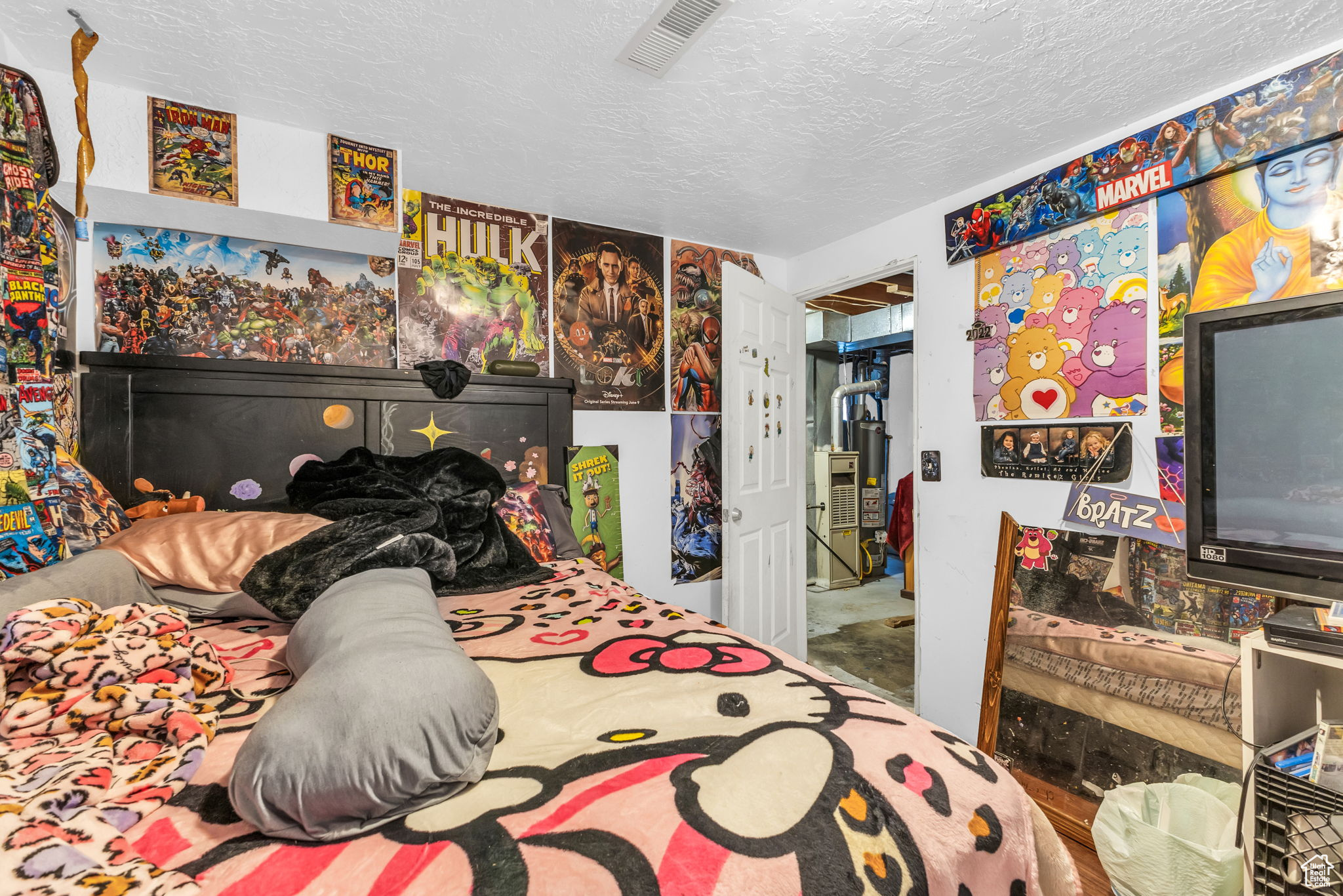 Bedroom with a textured ceiling