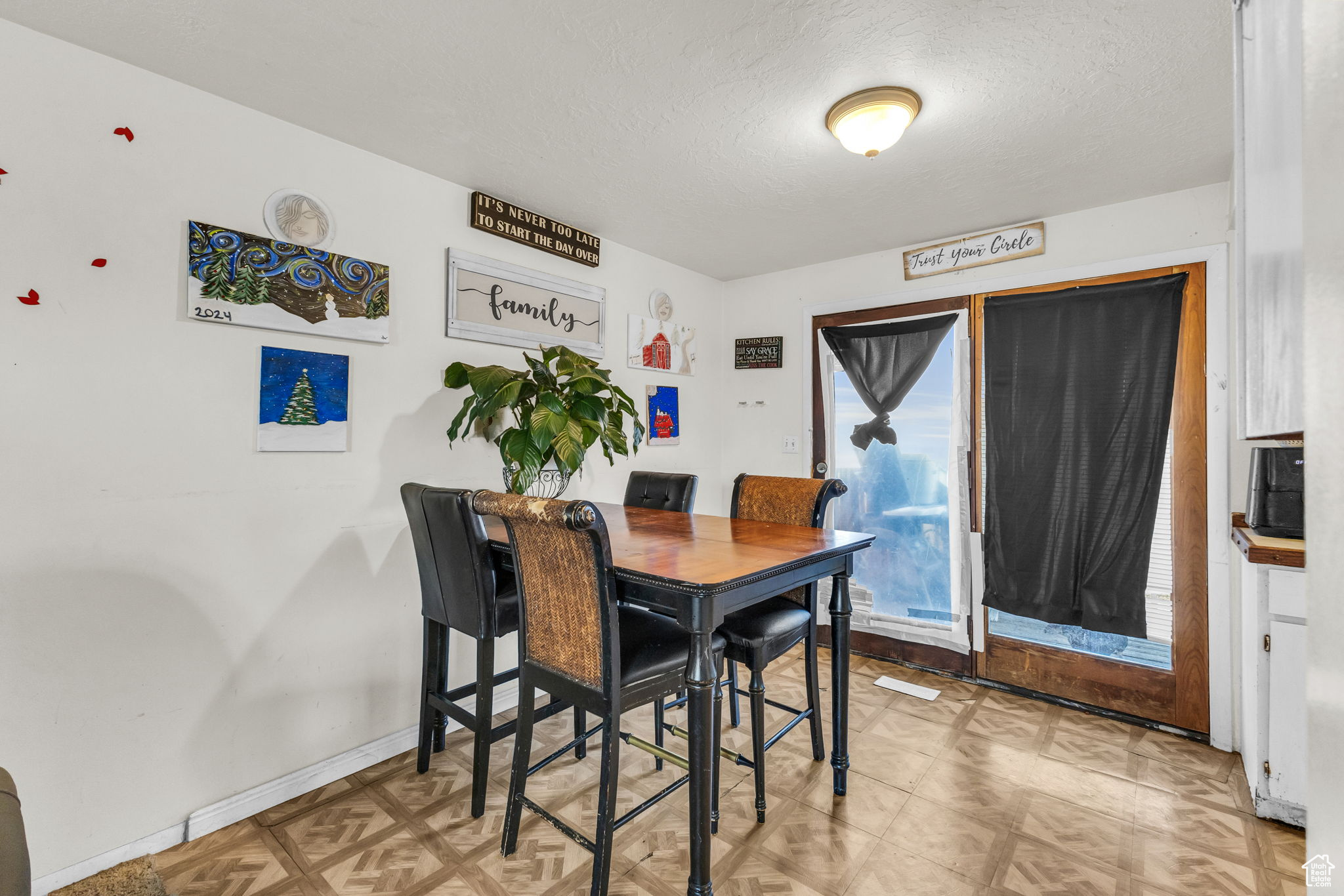 Dining area featuring a textured ceiling