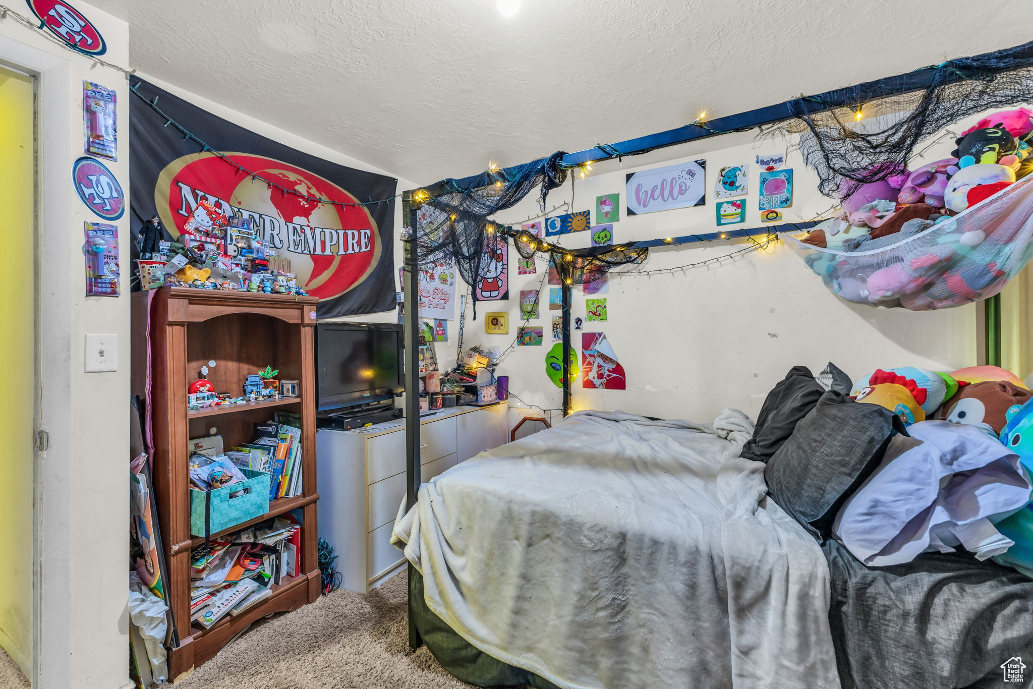 Carpeted bedroom featuring a textured ceiling