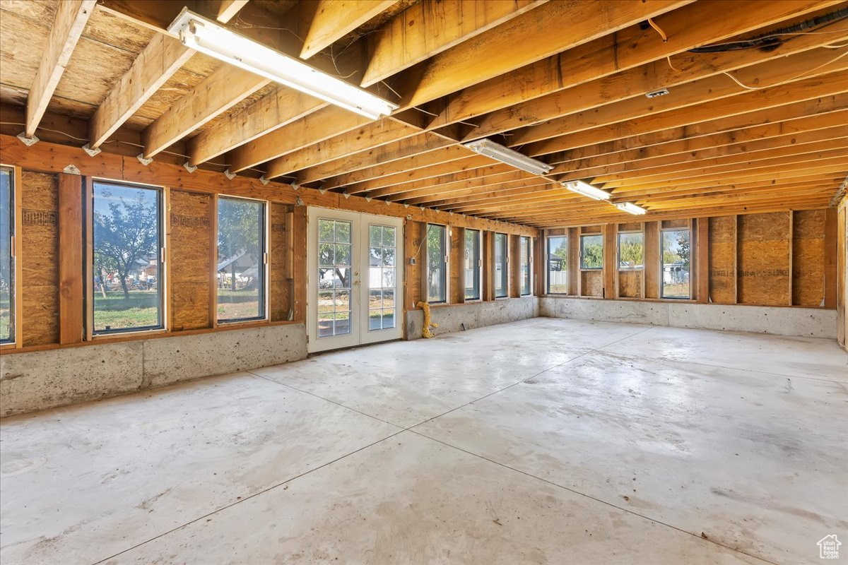 Miscellaneous room with a wealth of natural light and concrete floors