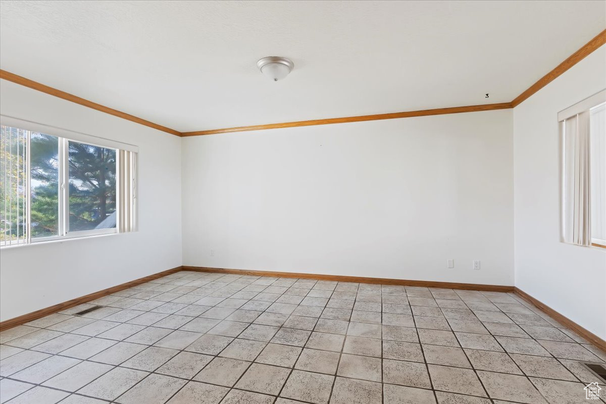 Unfurnished room featuring ornamental molding