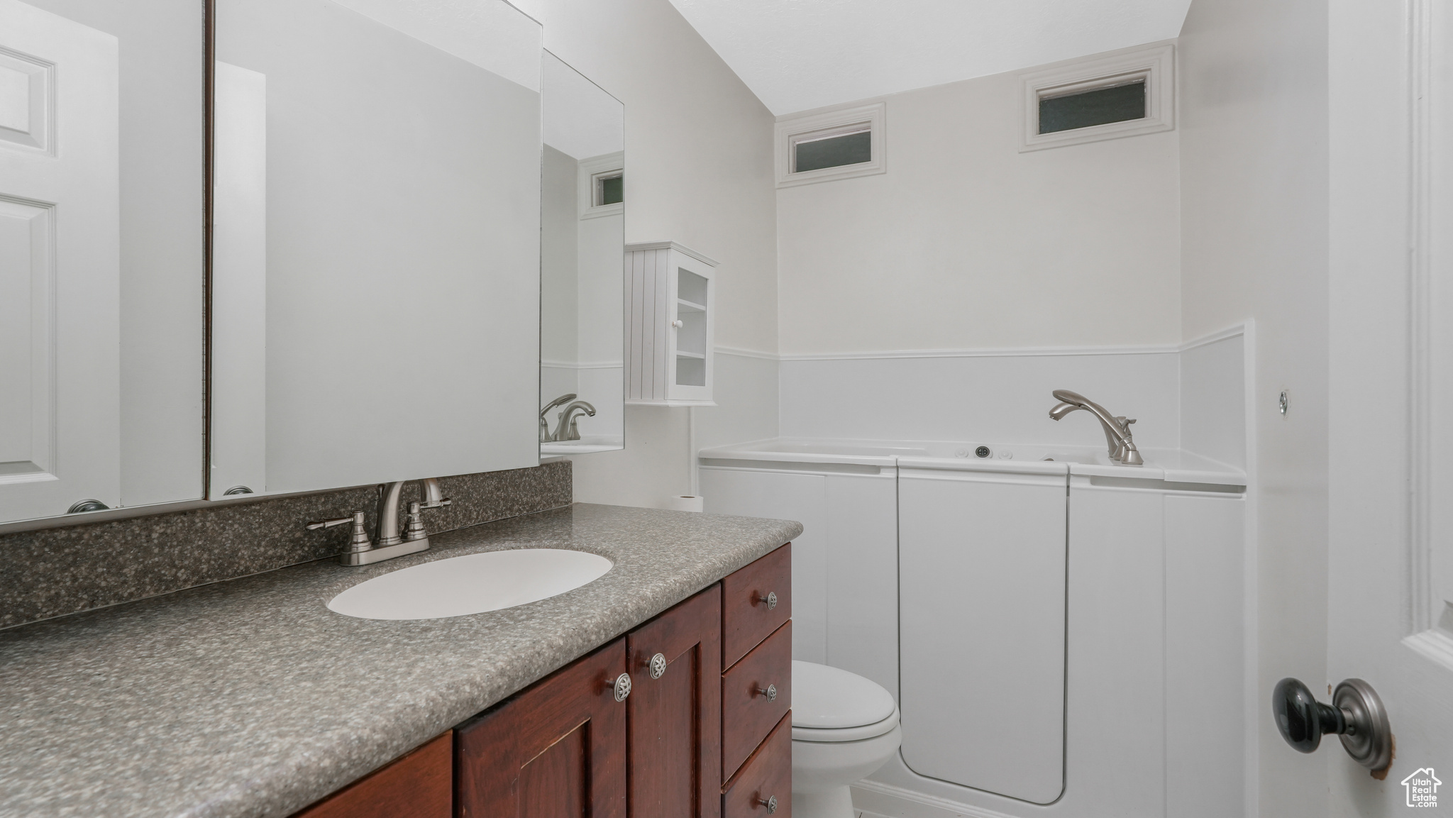 Bathroom with vanity and toilet