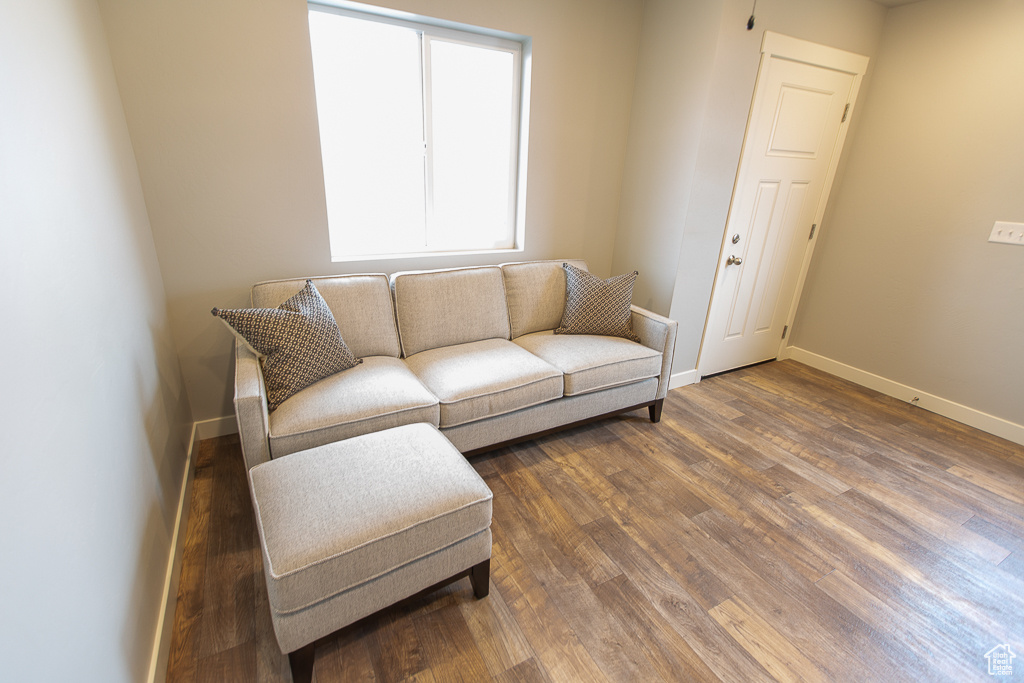 Living room with dark wood-type flooring