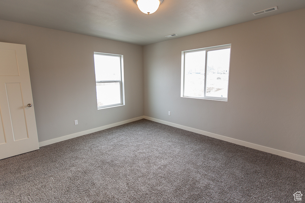 View of carpeted spare room