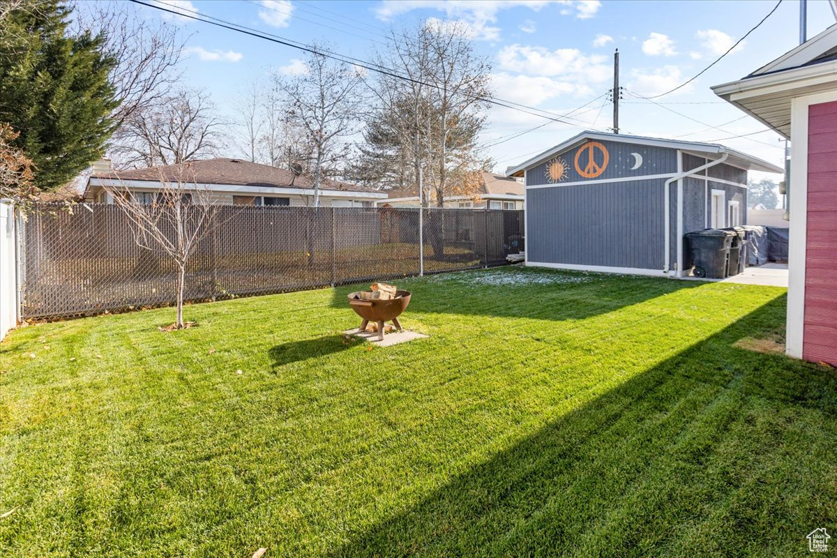 View of yard featuring yard and workshop