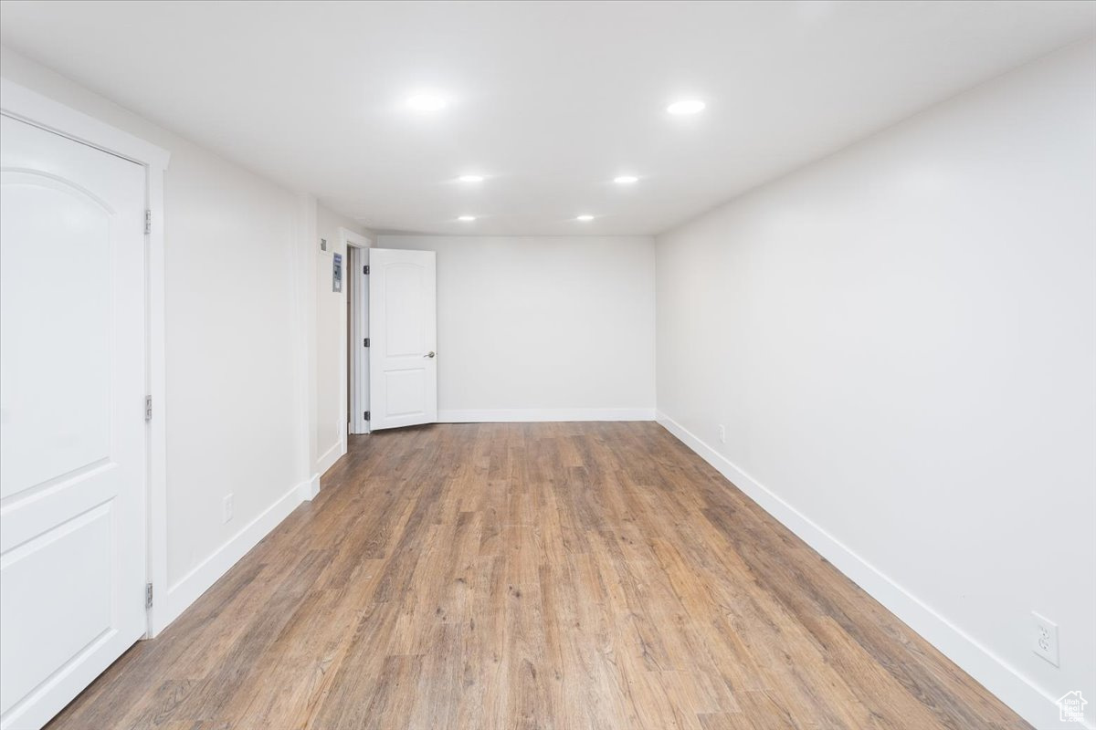 Family room with hardwood / wood-style flooring