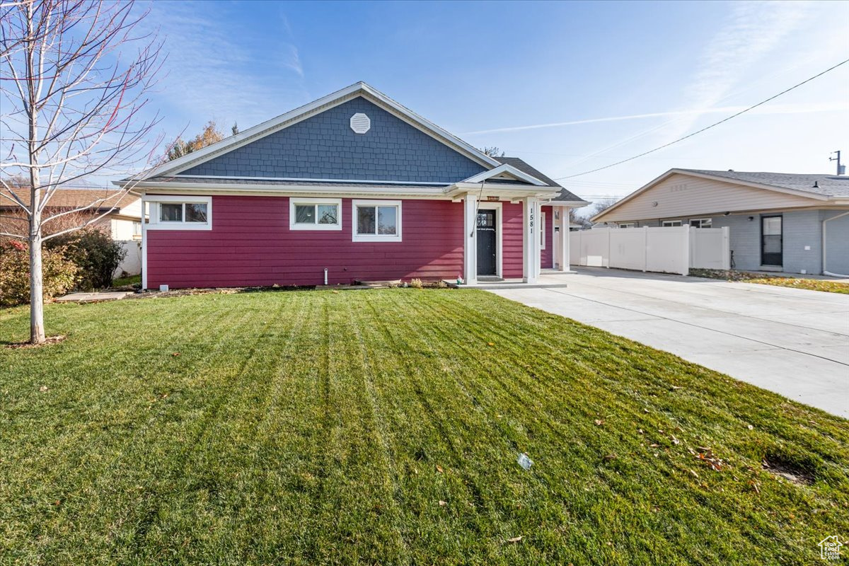 View of front of home featuring a front lawn