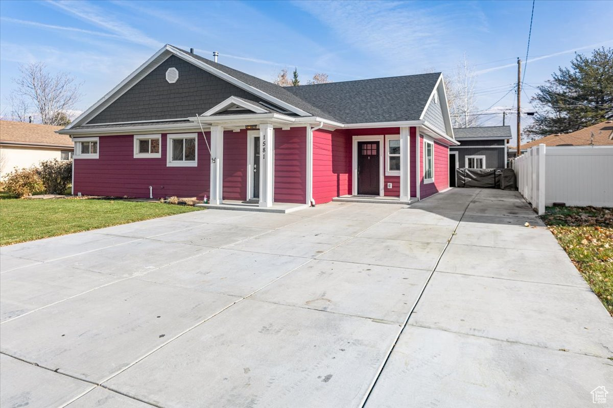 View of front of house with a front lawn