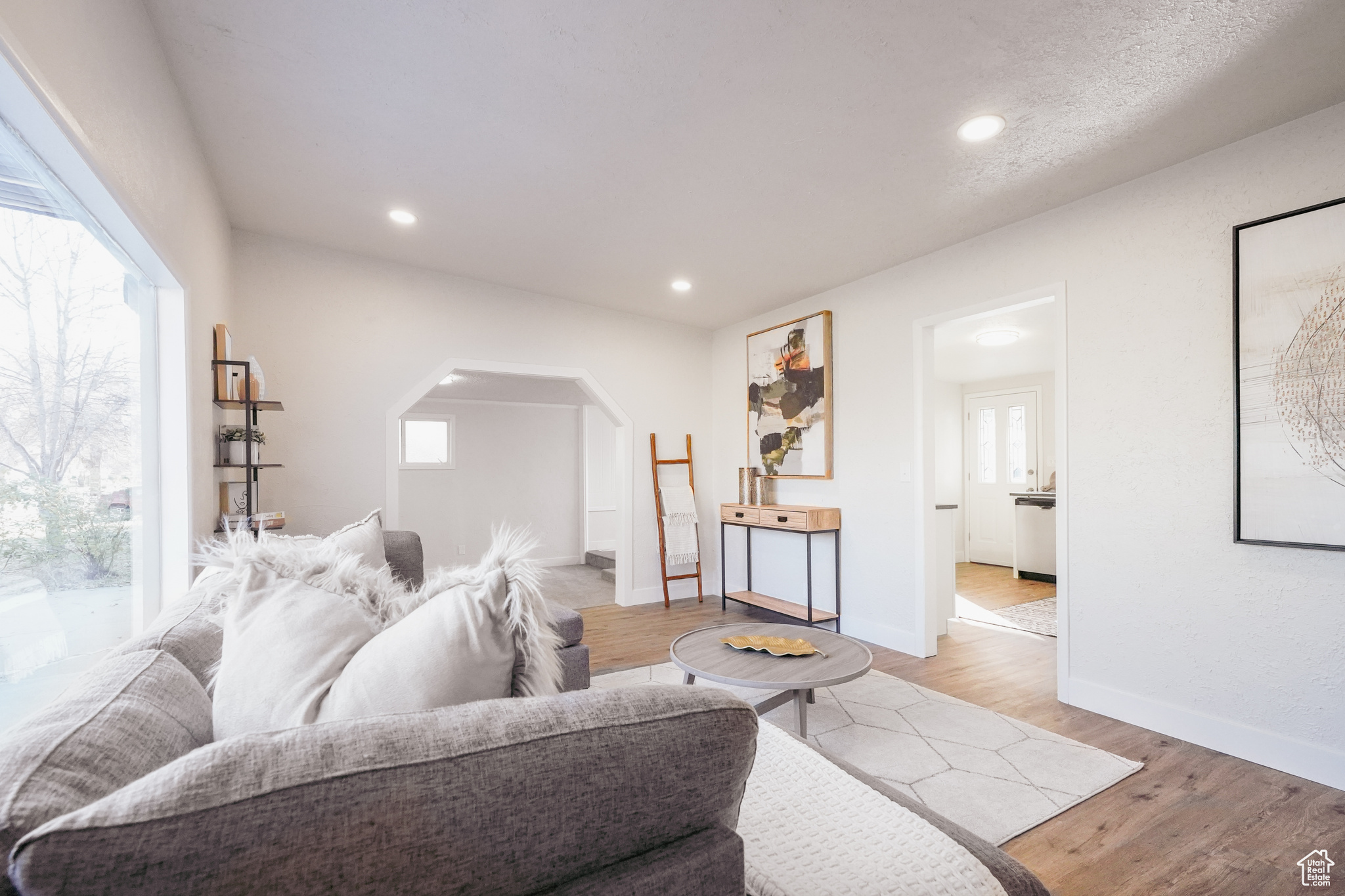 Living room with light hardwood / wood-style floors