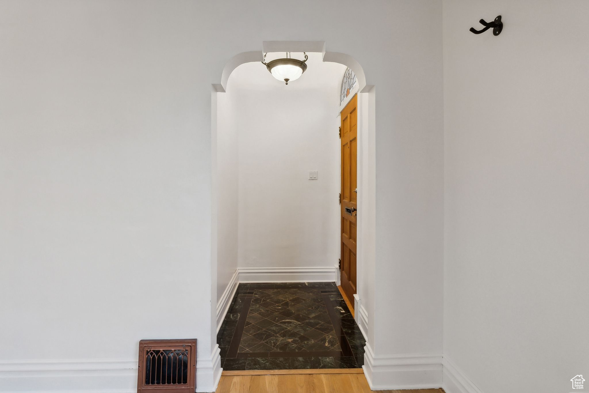 Hallway with wood-type flooring