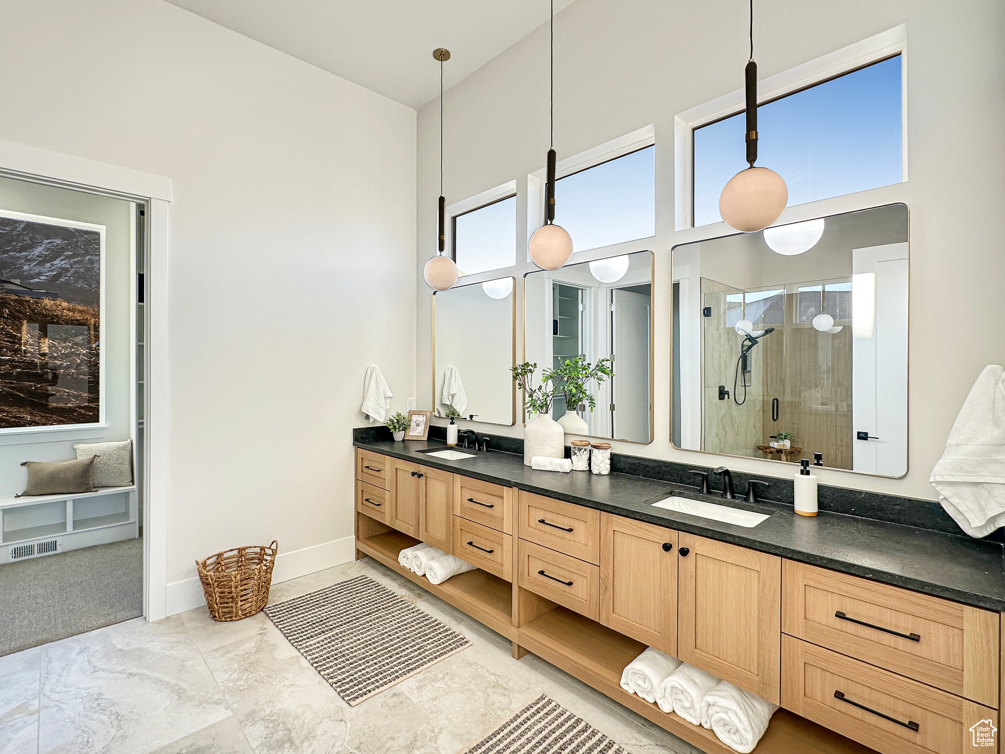 Bathroom featuring vanity and an enclosed shower