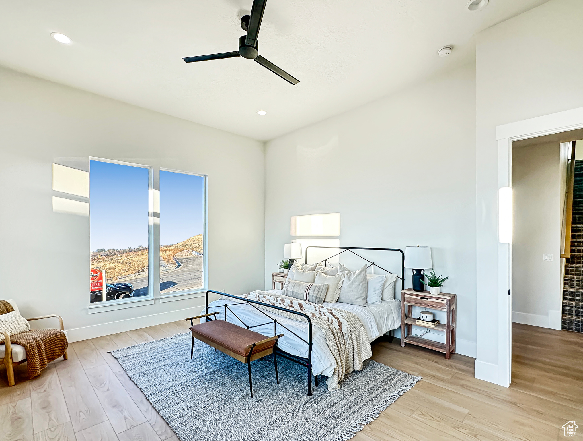 Bedroom featuring light hardwood / wood-style flooring and ceiling fan