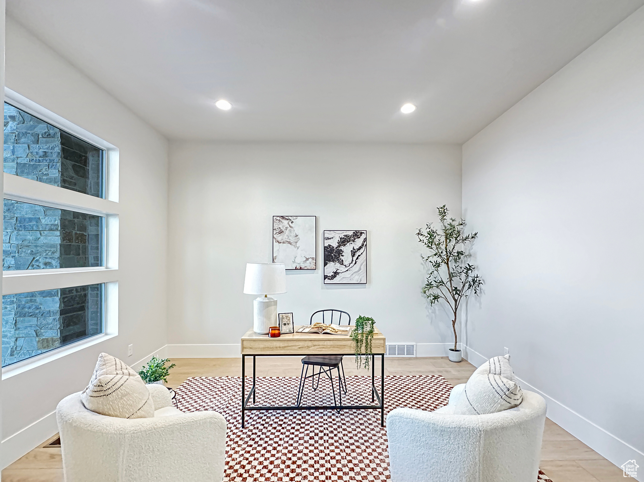 Home office featuring light hardwood / wood-style floors