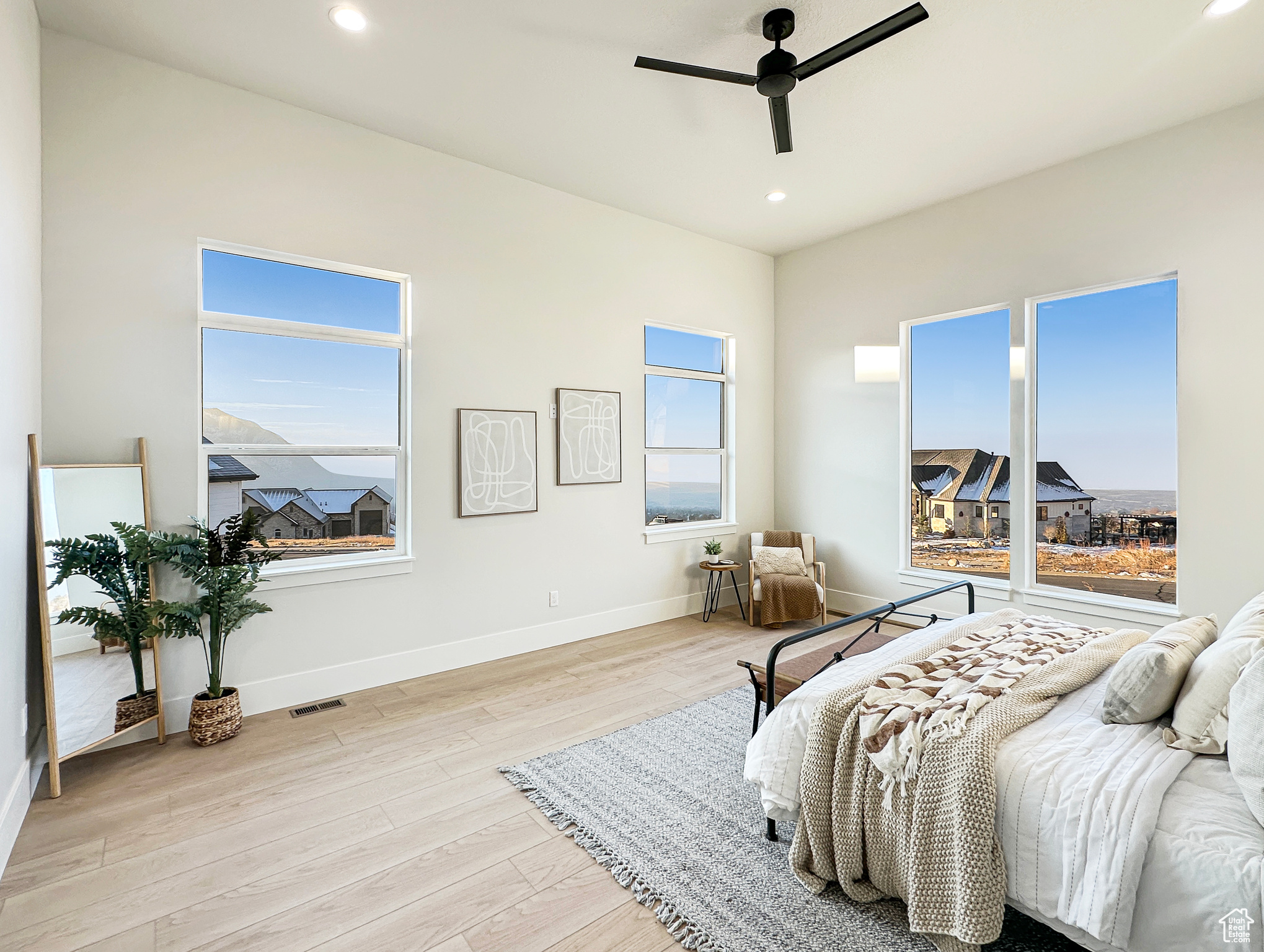 Bedroom featuring ceiling fan and light wood-type flooring