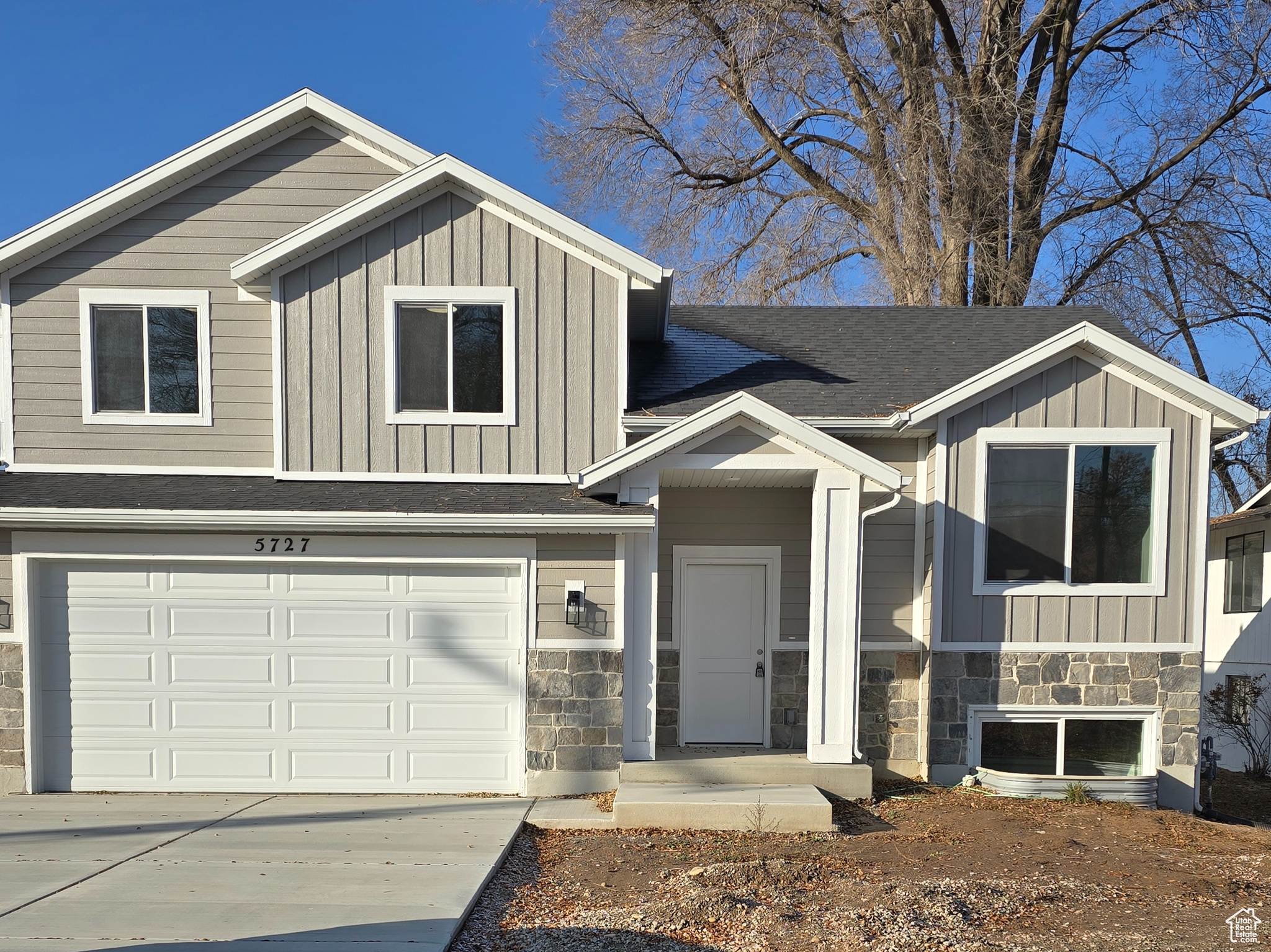 View of front of property with a garage