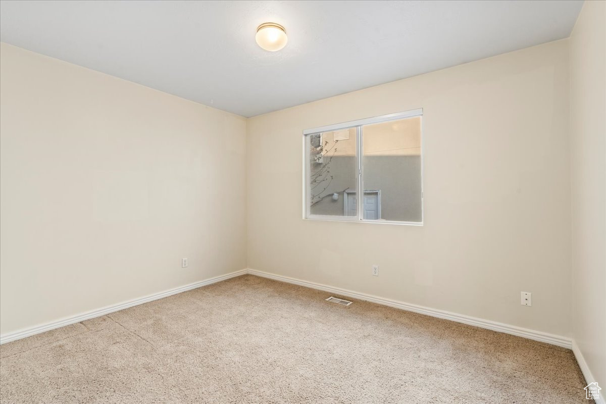 View of carpeted spare room