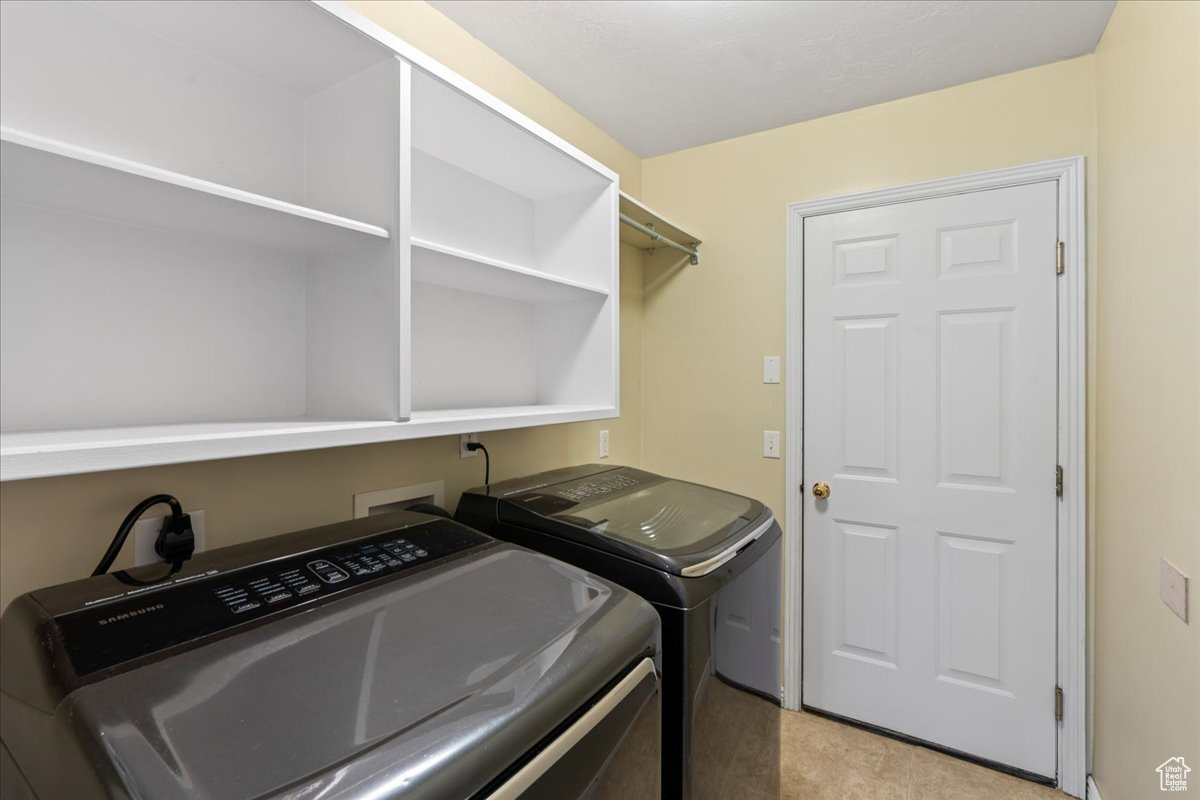 Laundry room featuring washing machine and dryer