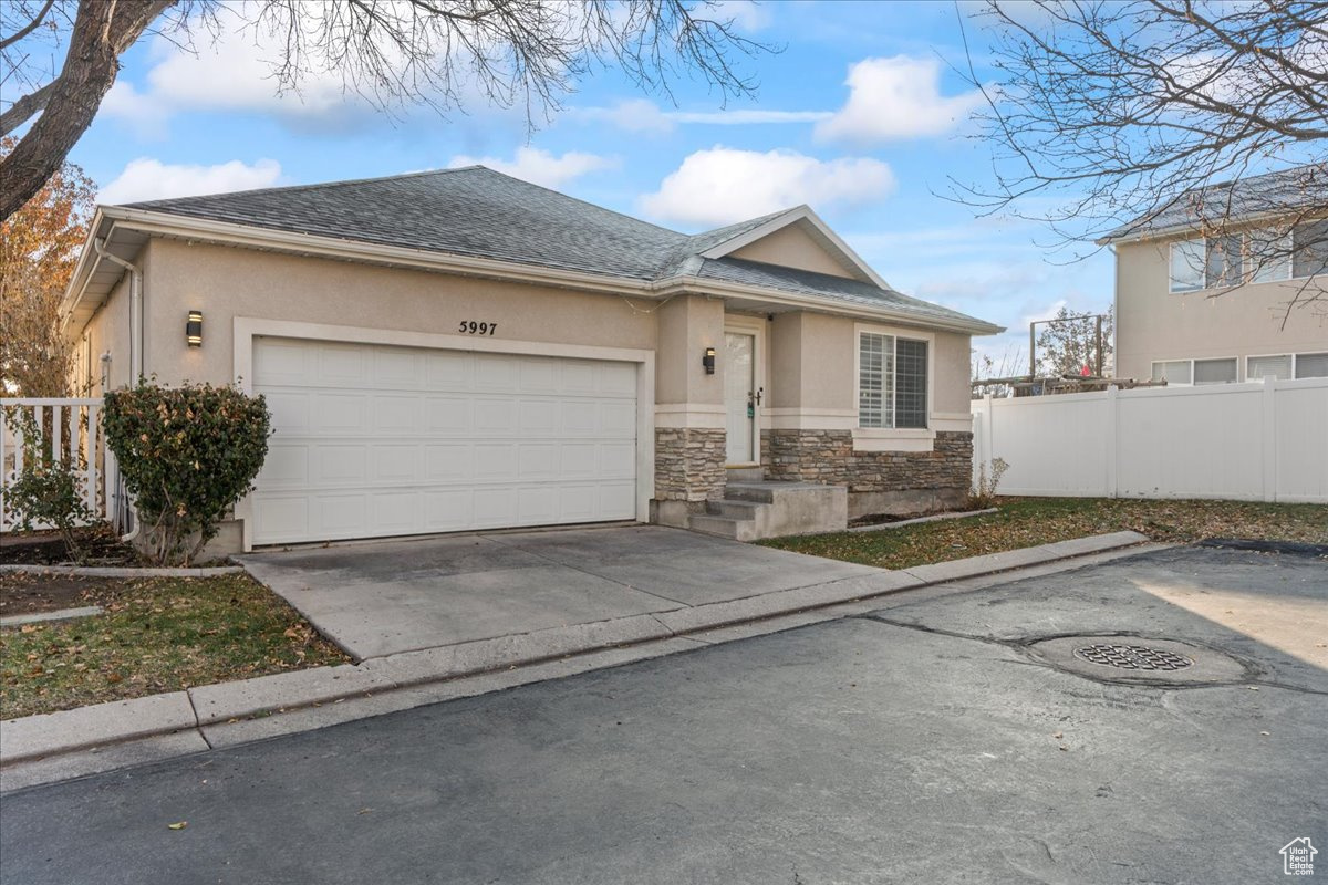 Ranch-style house featuring a garage