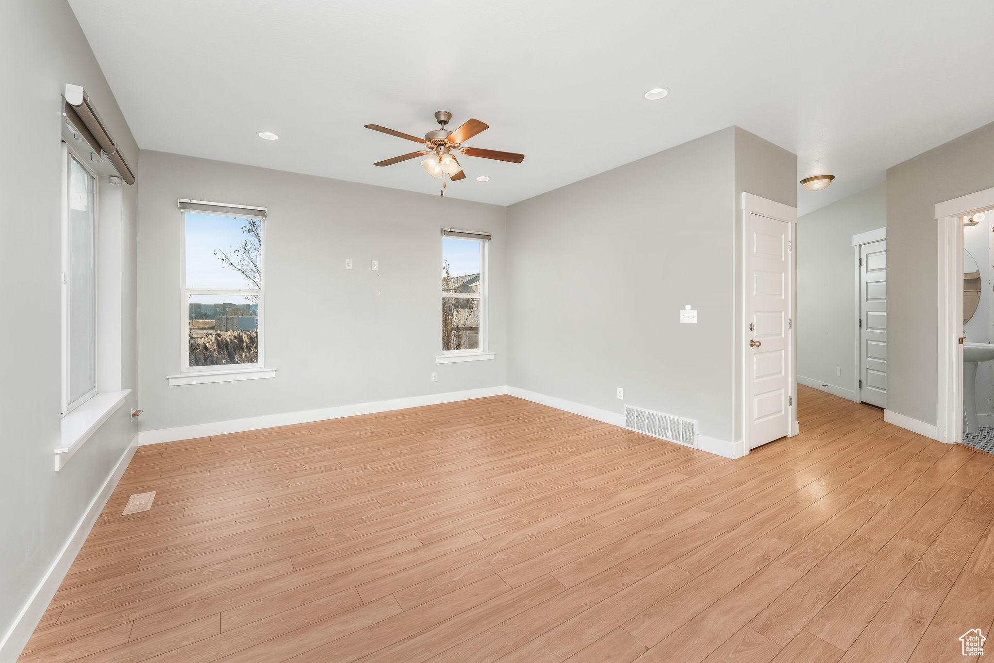 Spare room featuring light hardwood / wood-style flooring and ceiling fan