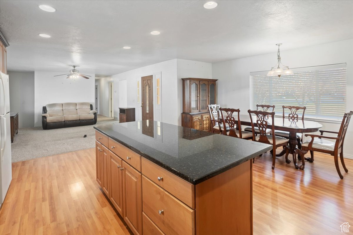 Great room showing kitchen, dining and living area