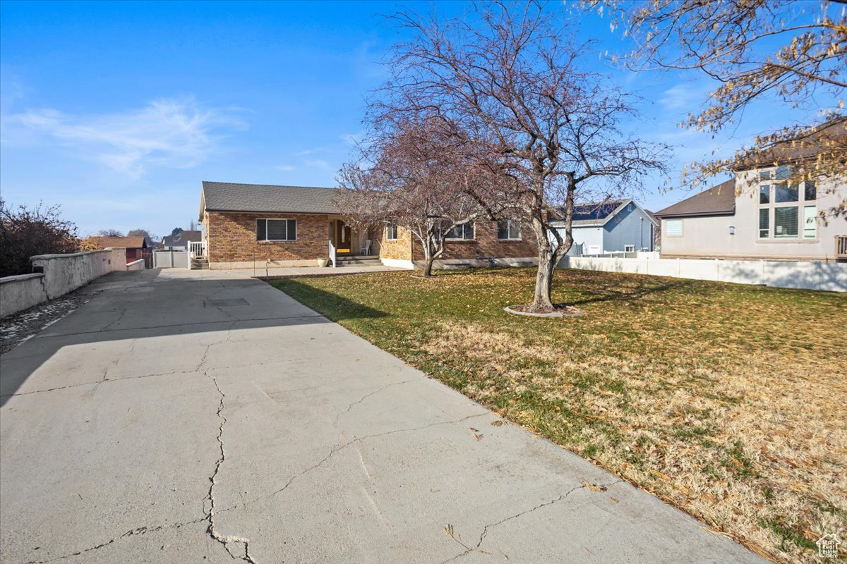 Front of home with large grassy front yard