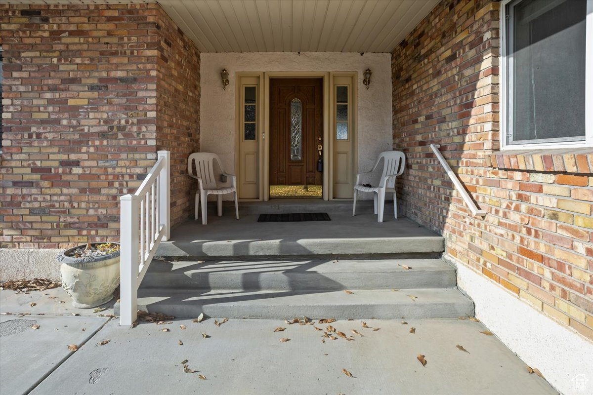 Doorway to property with covered porch