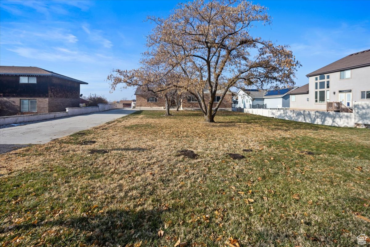 Front of home with large grassy front yard