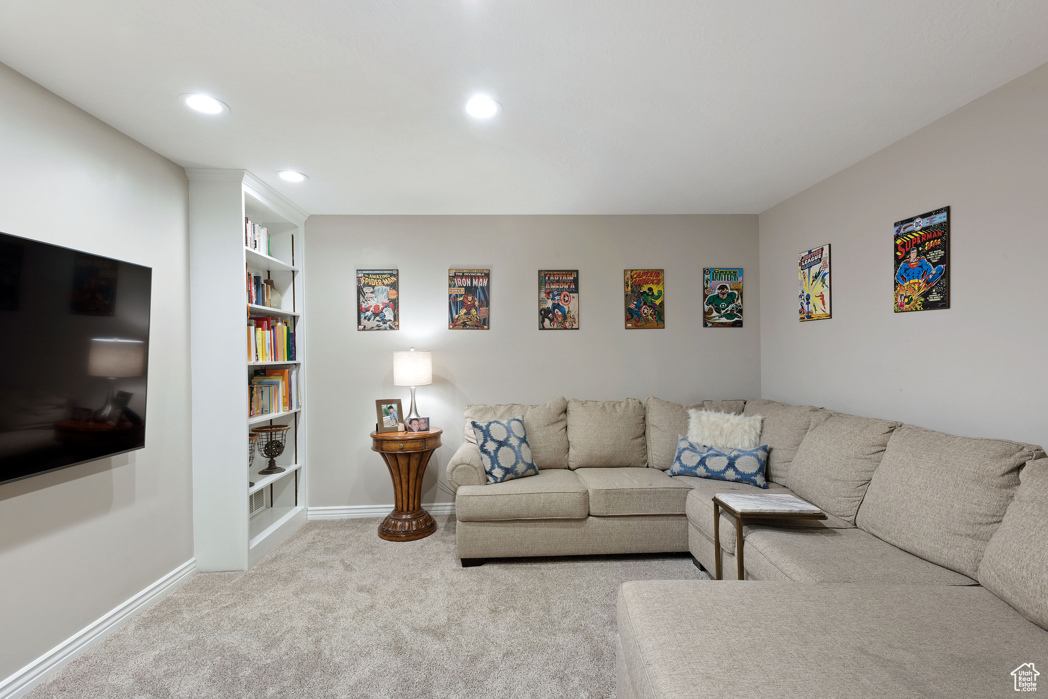 Carpeted living room with built in features