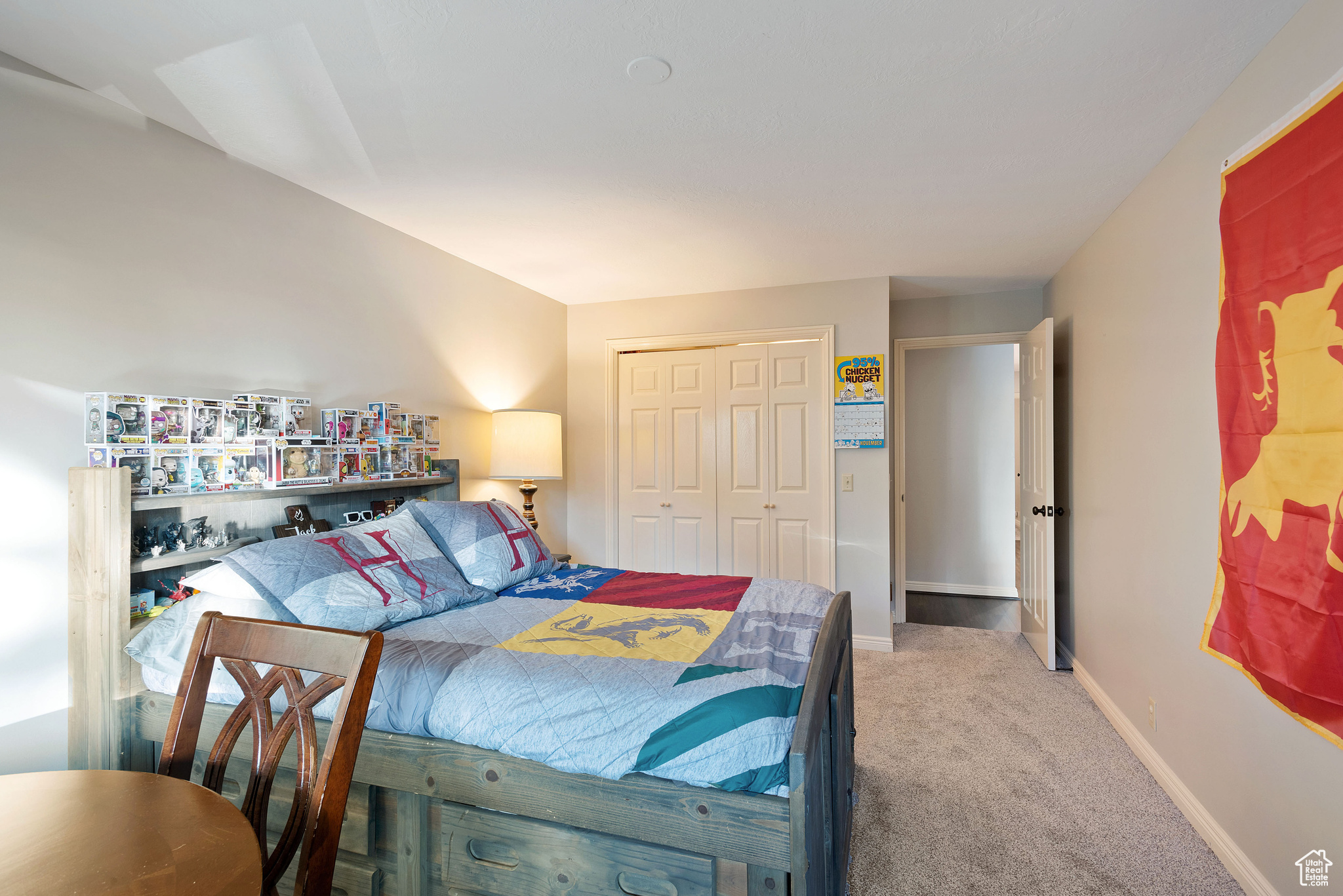 Carpeted bedroom featuring a closet