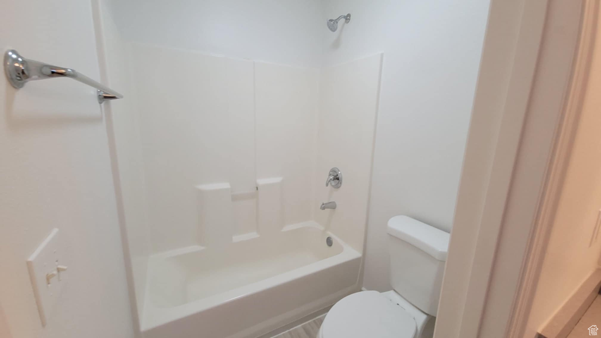 Bathroom featuring  shower combination and toilet