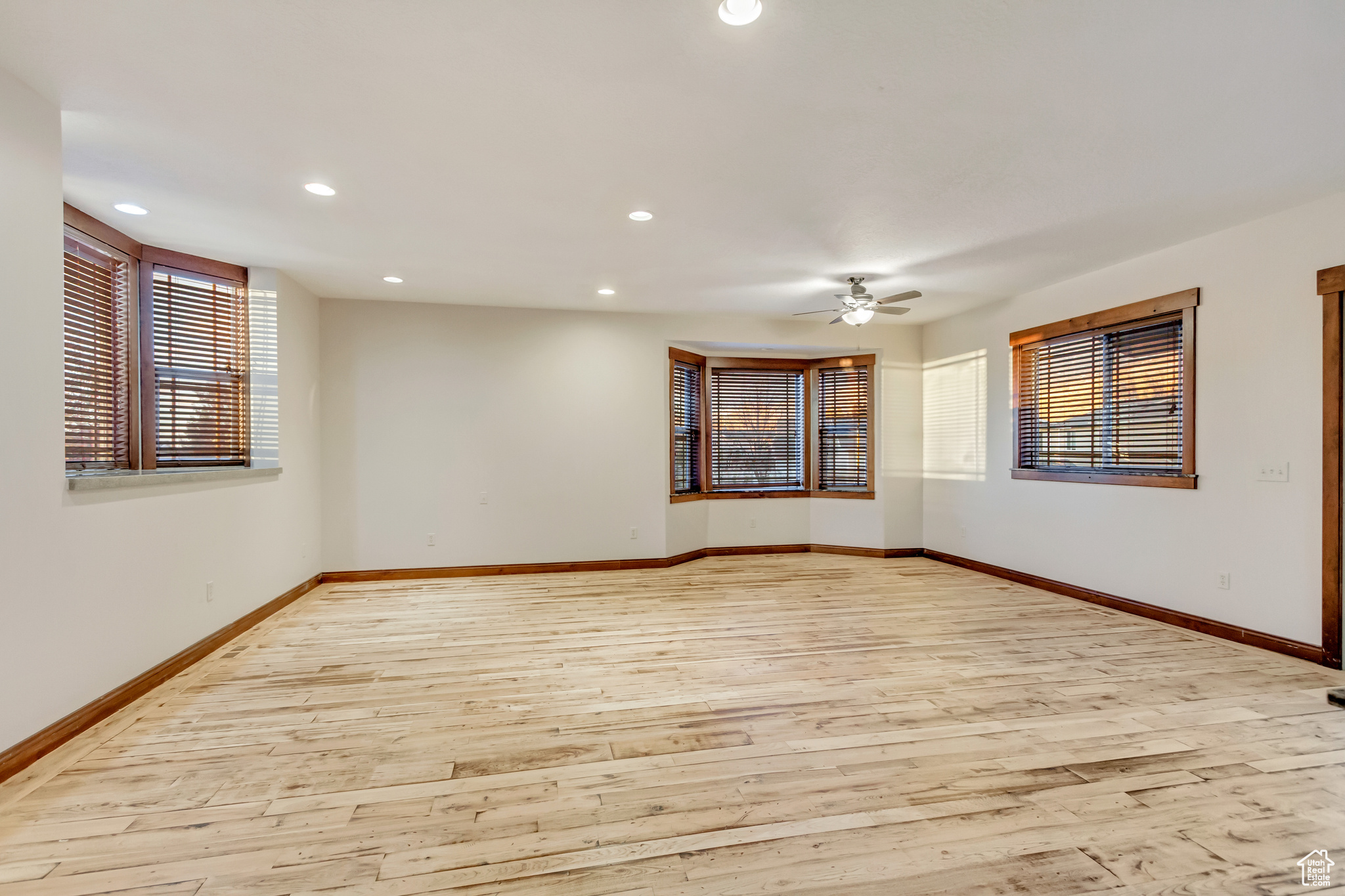 Empty room featuring light hardwood / wood-style floors and ceiling fan