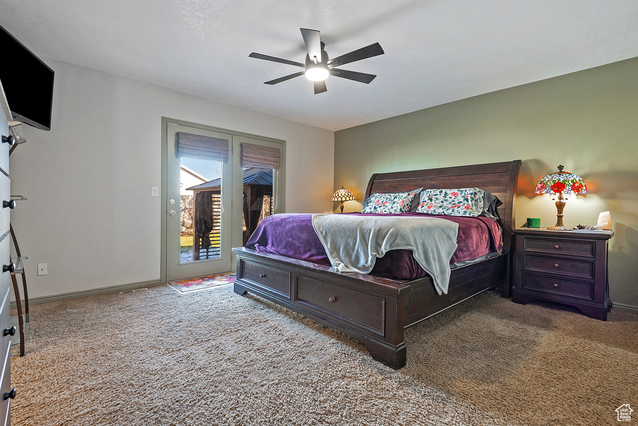 Bedroom with carpet floors, access to outside, and ceiling fan