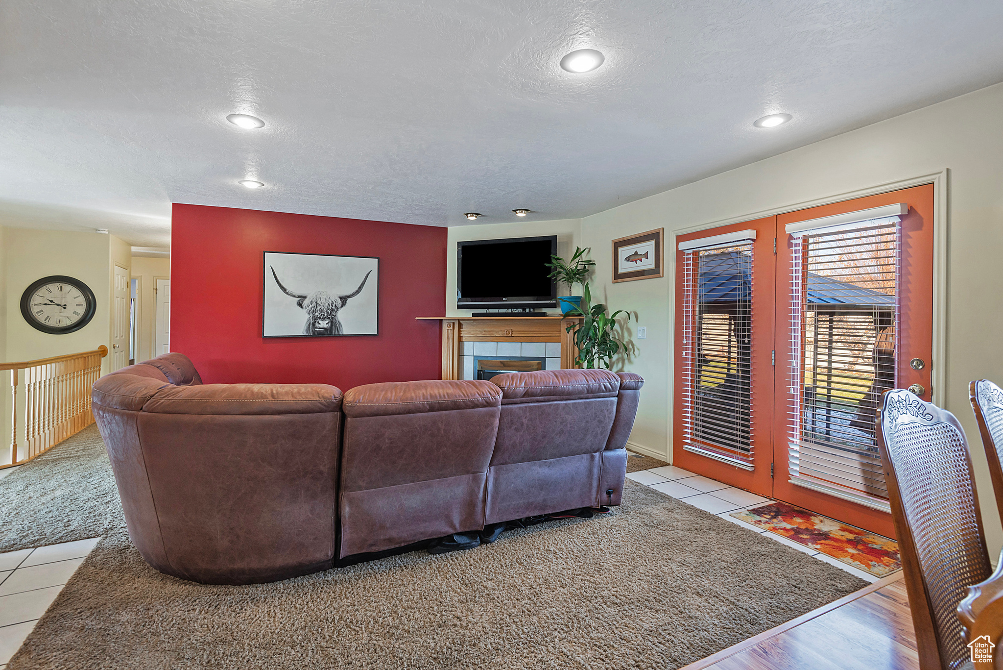 Tiled living room with a textured ceiling