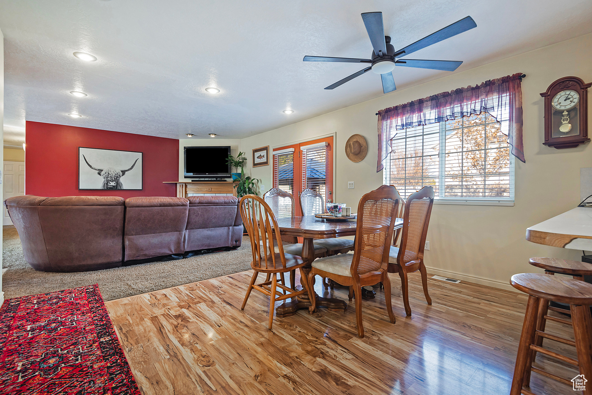 Dining area featuring ceiling fan and hardwood / wood-style flooring