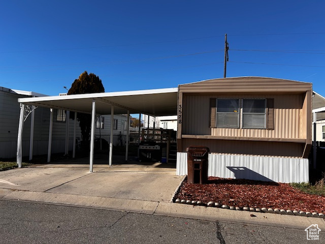 View of front of property with a carport